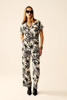 Q2 Combinaison à manches courtes avec motif tropical en noir et blanc